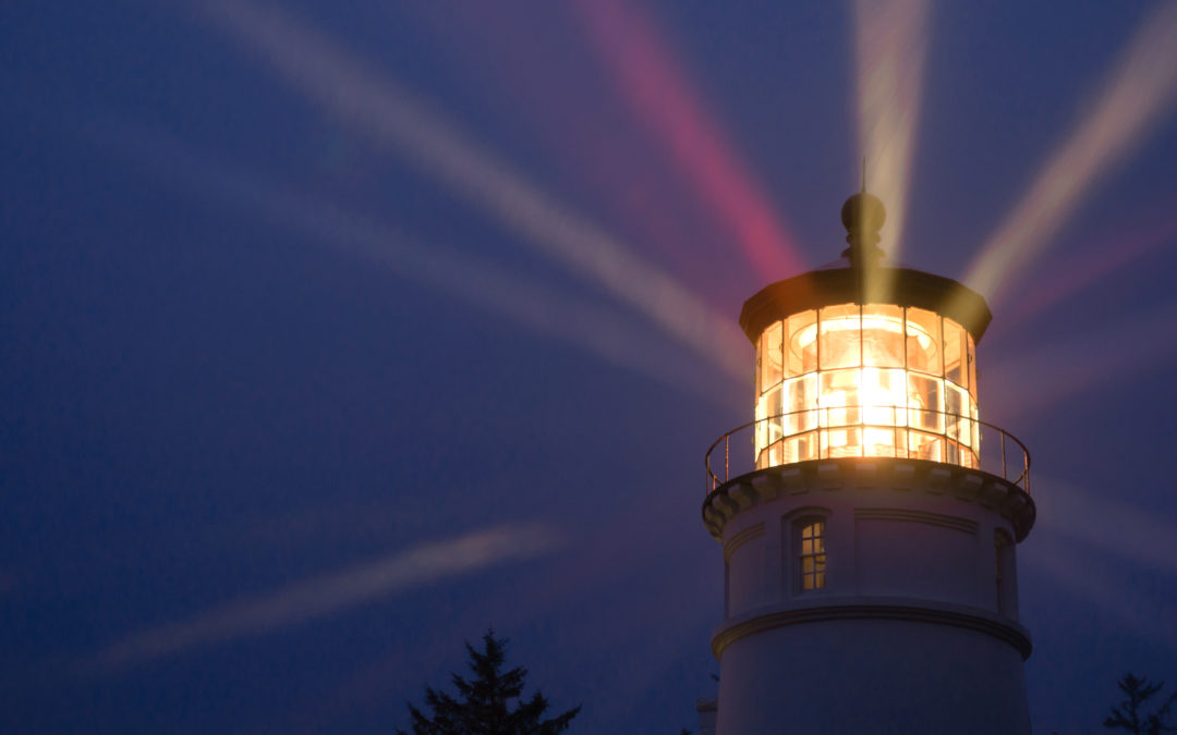 illuminating lighthouse in a dark sky